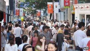Consumers at a shopping street in Seoul