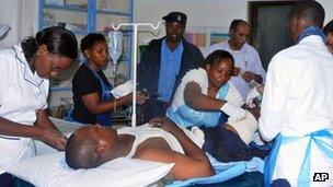 Doctors treat a patient in Mombasa, Kenya on 9 August 2012