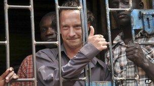 David Cecil stands in a court cell in Kampala, Uganda, 13 September 2012.