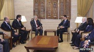 Syria's President Bashar al-Assad (centre right) meets UN-Arab League peace envoy for Syria Lakhdar Brahimi (centre left) in Damascus on Saturday in this handout photograph released by Syrian national news agency Sana