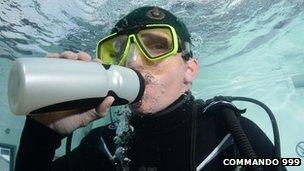 Chris Sirett drinking water during the underwater challenge