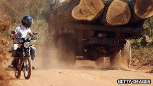 Motorcyclist and logging truck