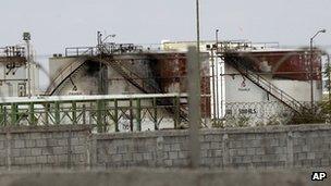 Burnt out Pemex gas tanks at the Petroleos Mexicans pipeline distribution centre