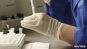 File picture of lab technician working with pipette