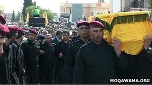 The coffin of Ali Hussein Nassif is carried by Hezbollah members in the Bekaa valley (1 October 2012)