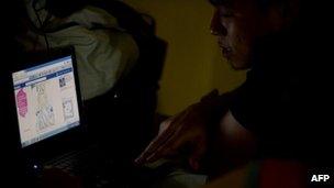 A man looks at a facebook account in Manila on 29 September, 2012