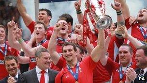 Wales celebrate the Grand Slam with the Six Nations trophy