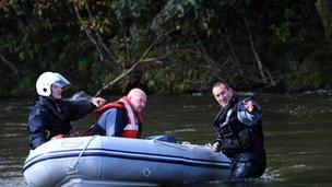 Search teams on the River Dyfi