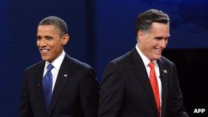 US President Barack Obama and Mitt Romney finish their debate at the University of Denver in Denver, Colorado, 3 October 2012