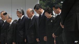 Hong Kong Chief Executive CY Leung (fifth from left) with officials mourning the boat crash victims, 4 October 2012