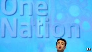 Shadow health secretary Andy Burnham speaking under Labour's new slogan at the conference
