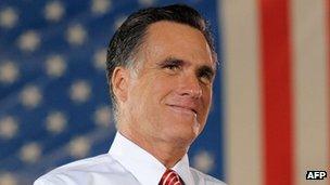 US Republican presidential candidate Mitt Romney reacts to his supporters cheering during campaign rally on October 4, 2012 in Fishersville, Virginia.
