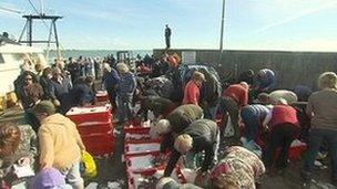 People check out boxes of monkfish at Kilmore Quay