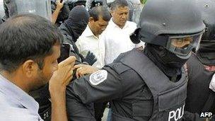 Members of the Maldivian police arrest former Maldives president Mohamed Nasheed (handout photograph from the Maldivian Democratic Party)