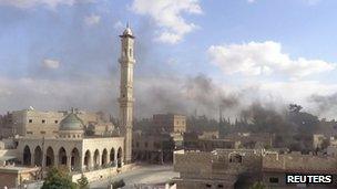Smoke rises over Maaret al-Numan in Idlib, Syria (8 Oct 2012)
