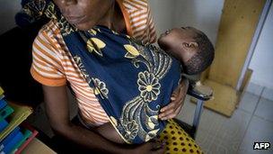 An HIV positive mother and her child at a clinic in Dar es Salaam, Tanzania - April 2011