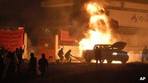 Police put out a fire after a clash with students involved in campus takeovers in Tiripetío, Michoacan state, Mexico.