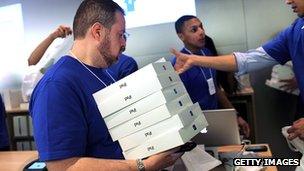 Apple store employee with iPads