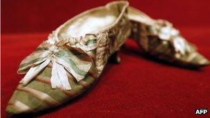 A pair of shoes which belonged to French queen Marie Antoinette appear at Paris Drouot auction house as part of a sale of "Historic memories of Royal Families"