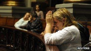 Anti-abortion campaigner praying in the Uruguayan Congress