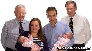 Angela and Daniel Formosa with surgeon Edward Kiely and Prof Agostino Pierro holding their twins Rosie (left) and Ruby (right) Formosa