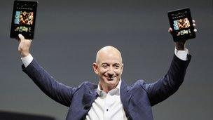 Amazon chief executive Jeff Bezos with Kindle Fires