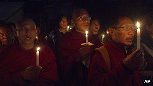 Exiled Tibetan monks hold a vigil