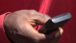 Kenyan man texting