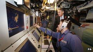 Defence Secretary Philip Hammond during a visit to HMS Victorious