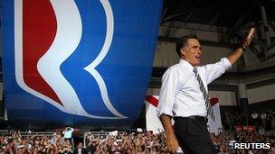 Republican presidential nominee Mitt Romney takes the stage at a campaign rally in Coral Gables, Florida 31 October 2012