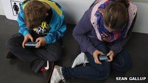 Children playing games on smartphones