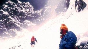 Chris Bonington and Doug Scott moving up towards the rock band above camp 5 at 27,000 ft, on Everest in 1975