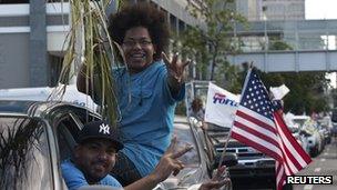Two Puerto Ricans celebrate after casting their vote on Tuesday