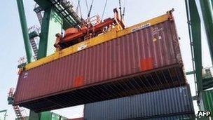 A cargo container being unloaded