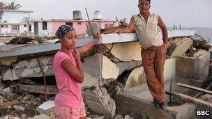 Joaquin Variento Barosso and his niece survey the ruins of their house