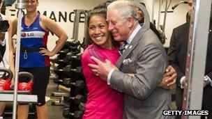 Prince Charles hugs rugby player Linda Itunu
