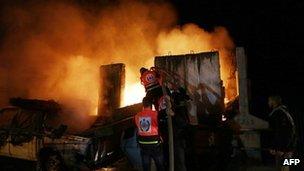Firemen tackle a blaze in Gaza City