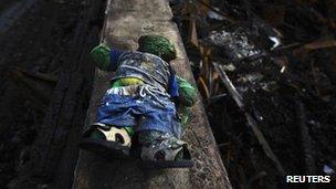 A burned stuffed toy is seen in a home devastated by fires during Sandy in the Belle Harbor section of the Queens borough of New York on 15 November 2012
