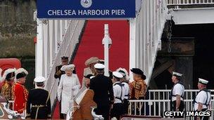 Queen Elizabeth walks down the gangway to her launch on June 3, 2012 for the start of the river pageant