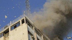 Smoke from Israeli air strike on building housing Hamas TV and other media organisations (18 Nov)