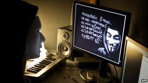 Masked hacker in France (file photo)