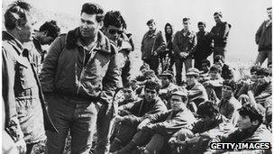 Defence Minister Shimon Peres (left) addresses Israeli commandoes after the raid on Entebbe in 1976