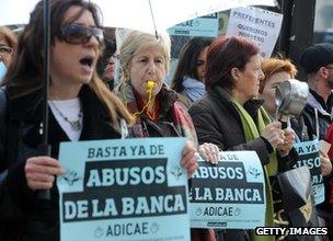 Ordinary savers protest outside a branch of Bankia