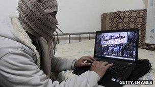 Syrian activist uses a computer in Damascus
