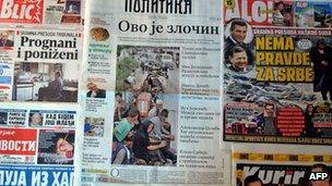 Front pages of Serbia's leading newspapers displayed on November 17, 2012, with one showing a column of Serb refugees fleeing Krajina in 1995.