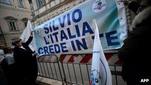 Supporters of Silvio Berlusconi hold a banner saying "Silvio, Italy Believes in You", Rome, 6 December 2012
