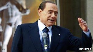 Then Italian Prime Minister Silvio Berlusconi speaks during the "Campus Mentis" award ceremony in Rome April 8, 2011
