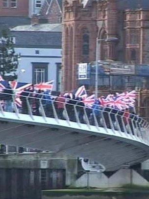 Loyalists march over Londonderry peace bridge