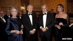 Mario Monti (2nd lt) and his wife Elsa (left) with the mayor of Milan Giuliano Pisapia (2nd rt) and his wife Cinzia