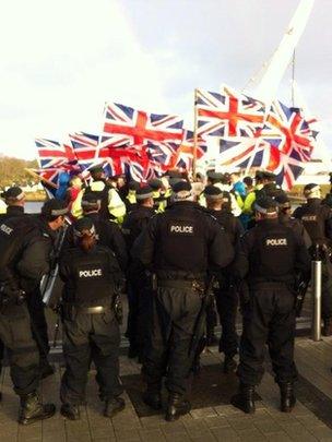 Loyalists carrying union flags marched over the Londonderry Peace Bridge